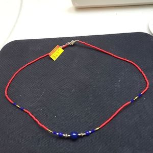 Beautiful Lapis bead necklace with silver beads and red coral beads.